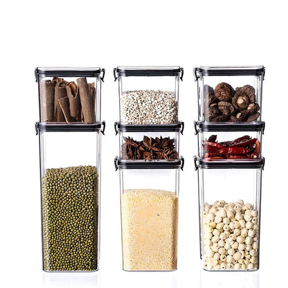 Eight transparent airtight plastic food containers in four different sizes with red sealing lids