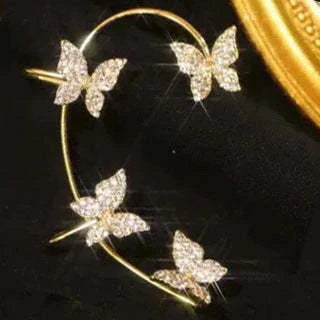Fashionable butterfly-shaped ear clips in gold and silver tones, showcasing a chic, European-inspired design.