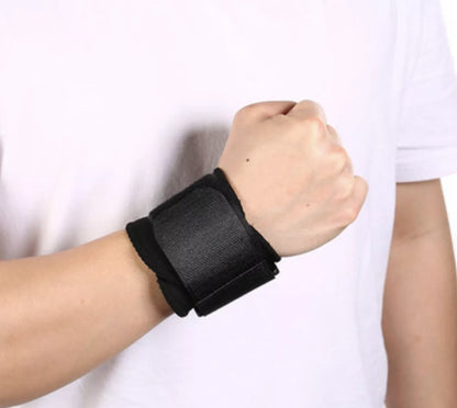 Black wrap-around wrist compression strap for sports and fitness support