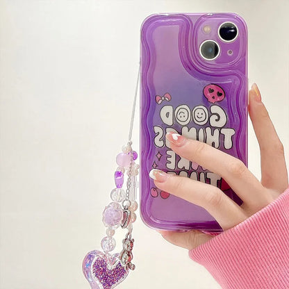 Purple graffiti design iPhone case with a silver love pendant chain attached