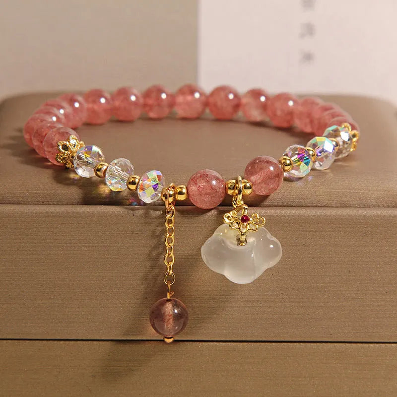 Women's adjustable crystal bracelet with strawberry quartz, white agate beads, and auspicious cloud charms