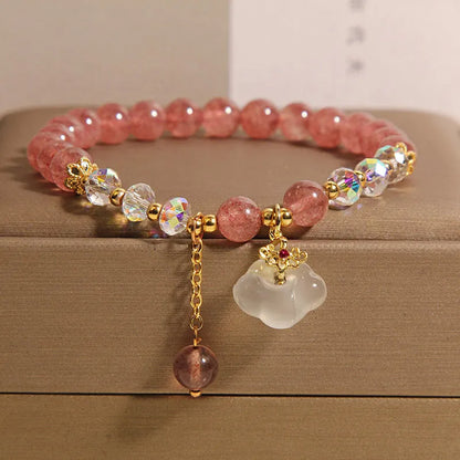 Women's adjustable crystal bracelet with strawberry quartz, white agate beads, and auspicious cloud charms