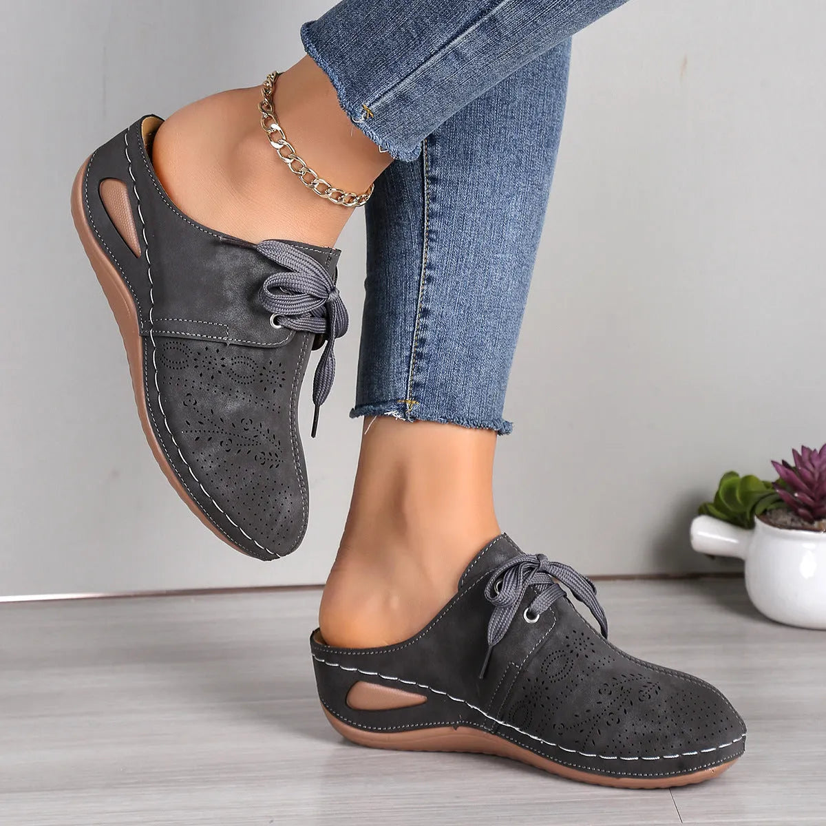 Women's summer lace-up slippers with hollow-out wedge design in black, suede upper, and rubber sole