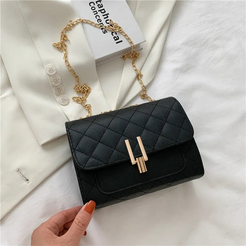 Women's solid colour PU leather crossbody bag with diamond lattice chain strap in black, green, or white.