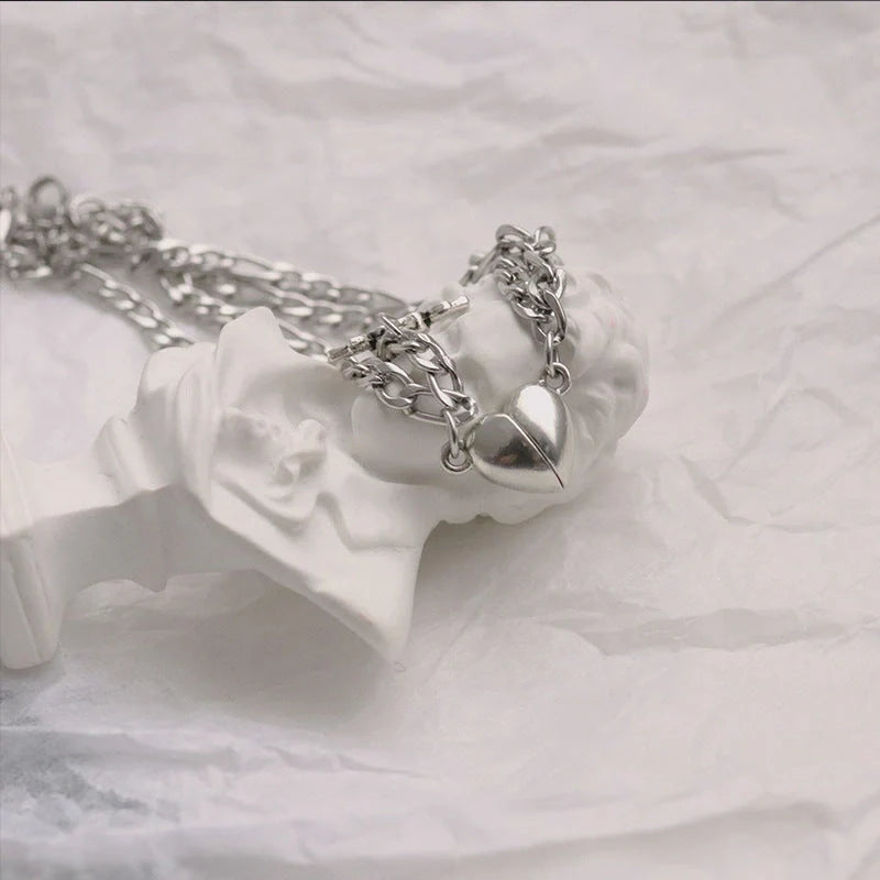 Stylish heart-shaped couple's bracelets with delicate floral accents made of durable iron chain