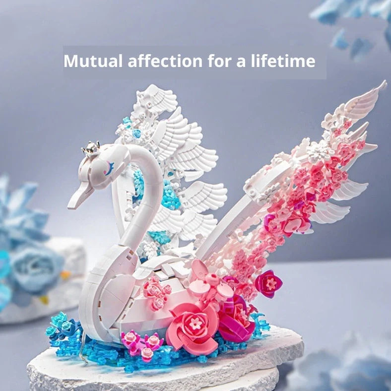 Colourful plastic building blocks assembled as peacock and swan designs with flower-like brocade patterns