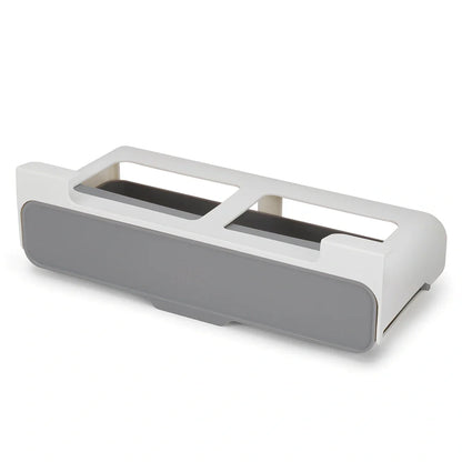 White plastic hanging spice rack with six clear glass bottles, mounted on kitchen door for punch-free storage