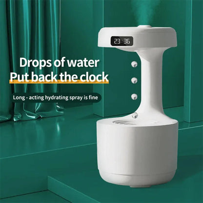 White columnar anti-gravity humidifier with LED clock display on a wooden desk
