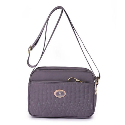 Casual women's crossbody messenger bag in nylon with polyester lining, available in multiple colors