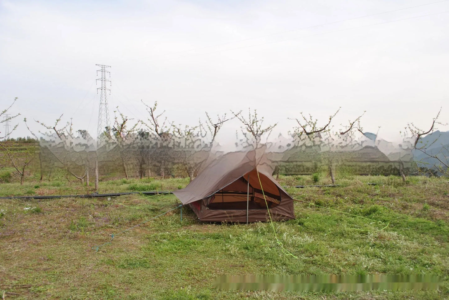 Brown and white portable A-line camping tent set up with hiking poles, showing its spacious interior for 2-3 people.