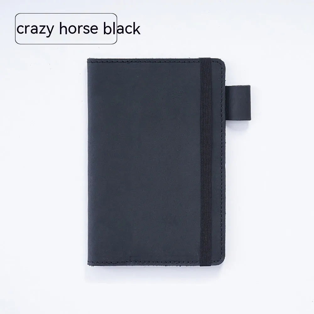 Handmade cowhide kraft notebook open showing wood-free paper, in dark green colour