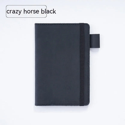 Handmade cowhide kraft notebook open showing wood-free paper, in dark green colour