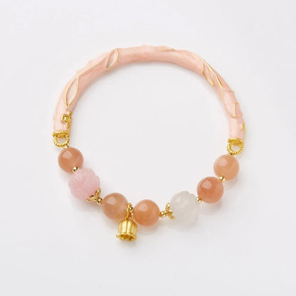 Chinese style sunstone and jade half bracelet with lily motifs measuring 20-24cm
