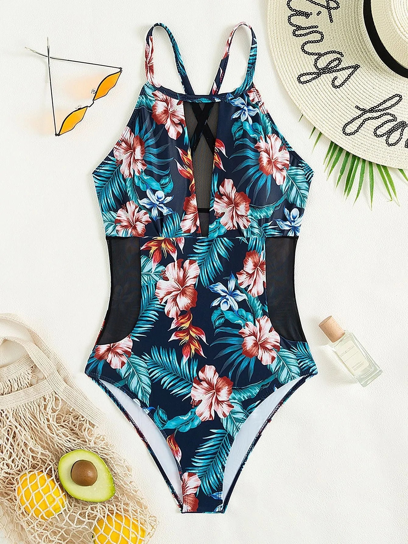 Women's deep V-neck one-piece swimsuit with a printed pattern in a solid colour.