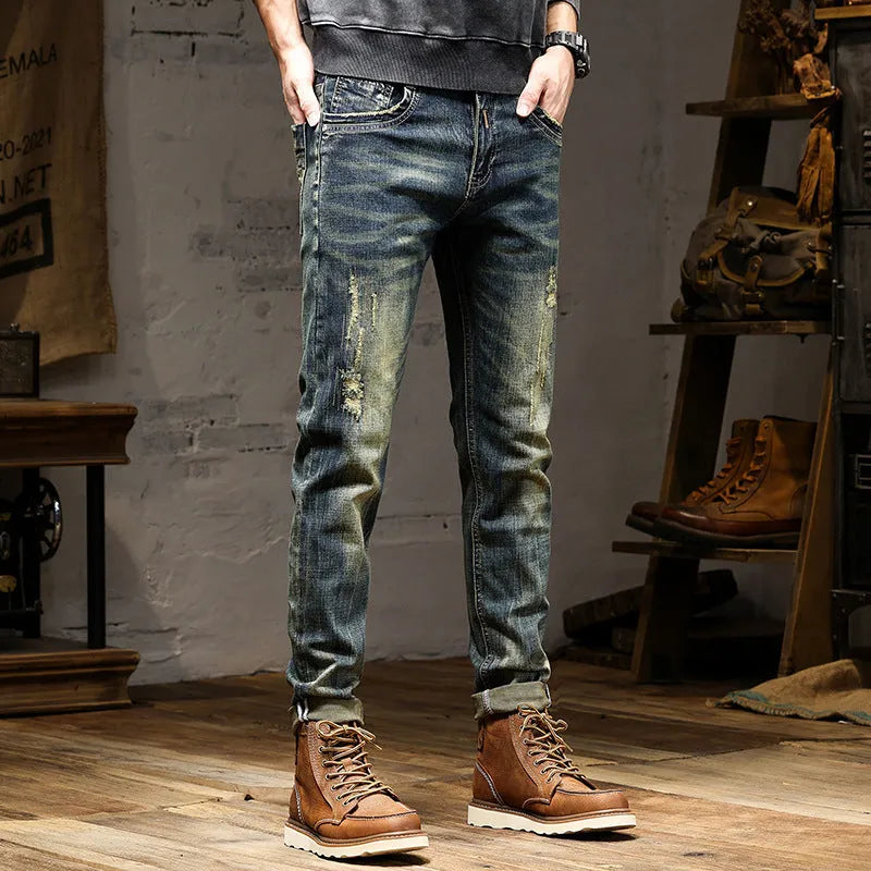 Men's skinny fit stretch denim jeans in retro colour with zip fly, shown in leisure setting.