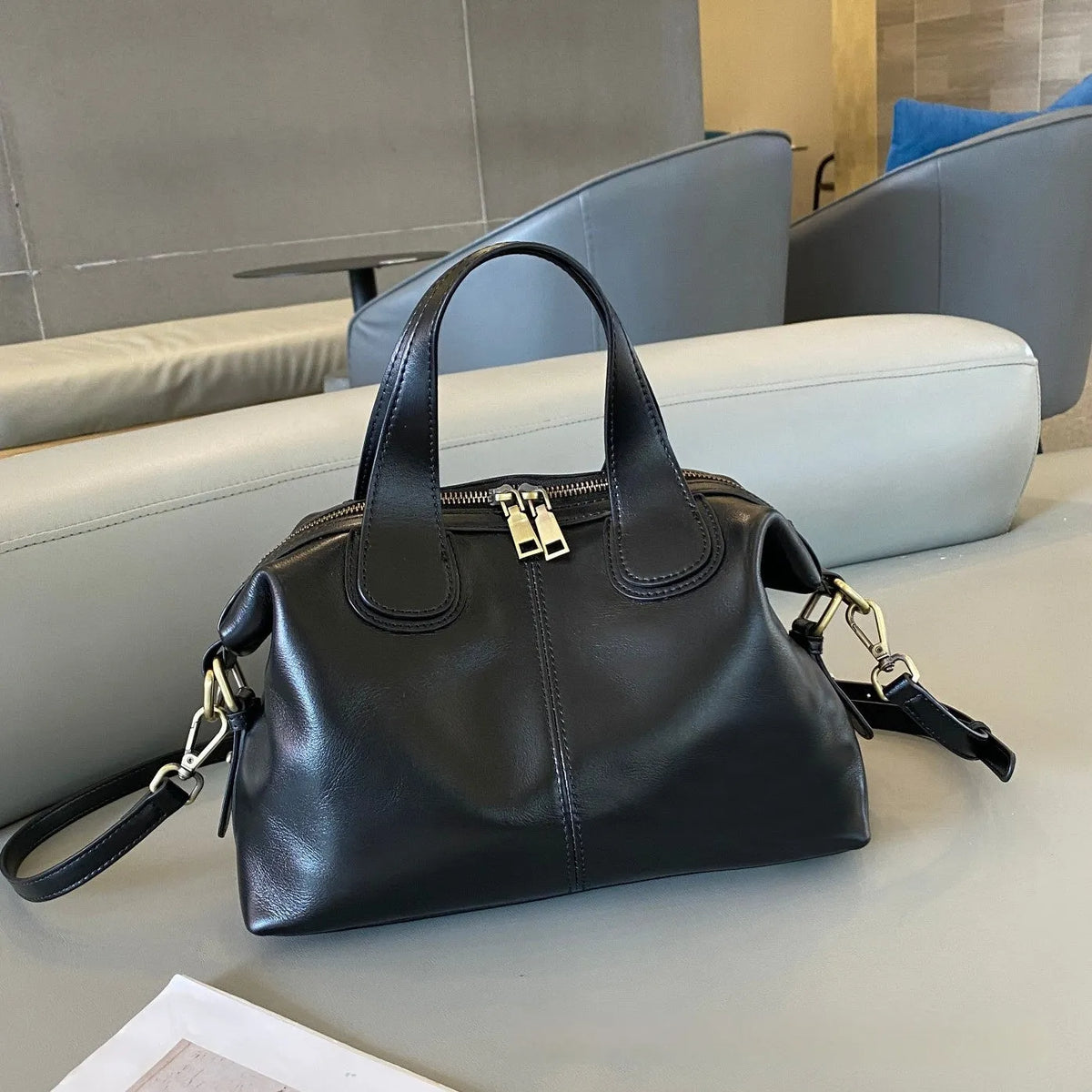 Soft pillow-shaped top grain leather handbag, 30cm x 13cm x 22cm, with double straps and inner patch pocket