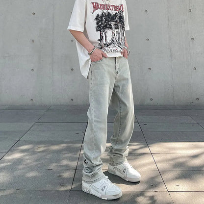 Khaki vintage washed straight-leg jeans with yellow mud dye and letter print, non-stretch mid-rise denim trousers.