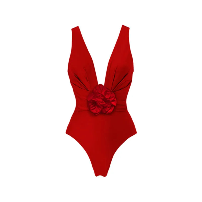 Red one-piece swimsuit with V-neck halter, open back, and a matching long skirt, with a detachable fabric flower.