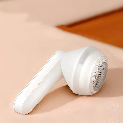 White and green charging shaving machine with straight plug design measuring 13.5cm