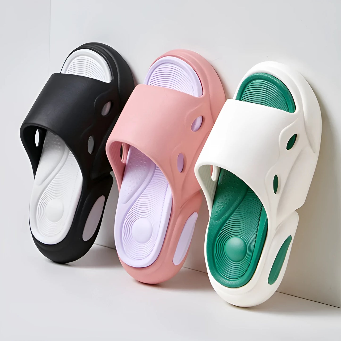 Two-colour thick-soled EVA slippers with a leather lining, shown in pink and purple.