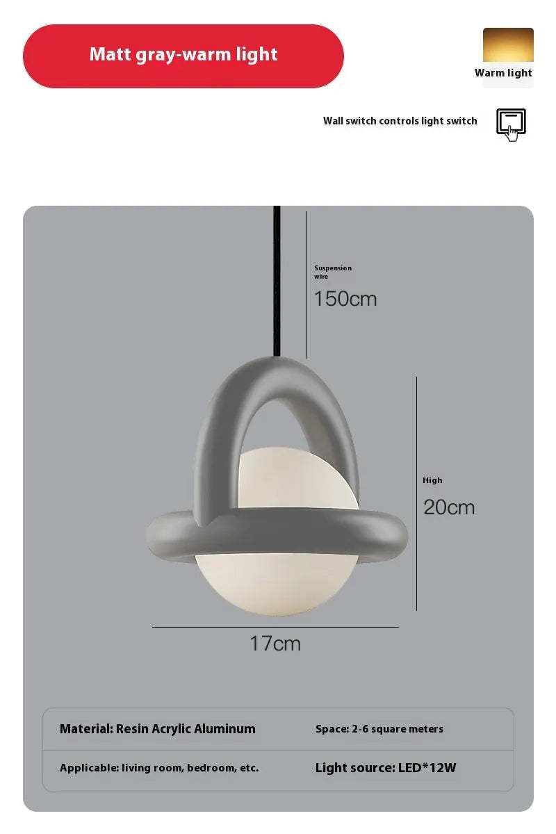Danish designer hanging line lamp with adjustable cord and matte finish in bedside setting
