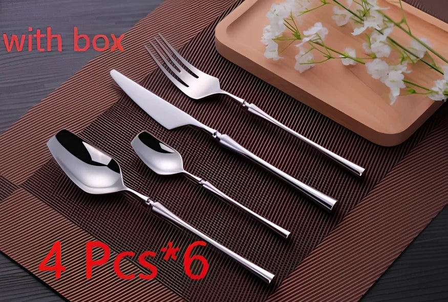 Four-piece stainless steel cutlery set showing main knife, fork, spoon, and teaspoon with mirror finish