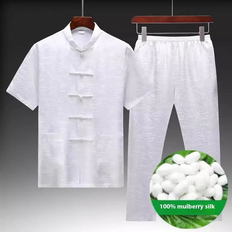 Traditional light green mulberry silk Tang suit for men on a hanger.