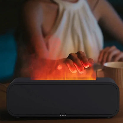 Black Flame Dynamic Aroma Diffuser with colour-changing lights and remote control on a table.