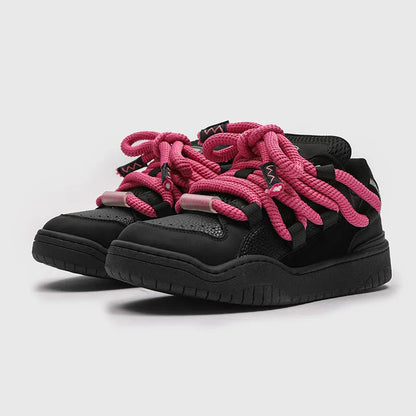 A pair of thick-soled casual lace-up shoes in a solid colour with a round toe and mesh lining.
