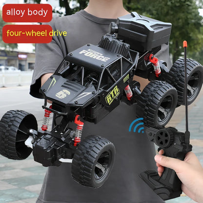 Children's remote control car with six wheels and 38cm climbing capability in black, gold, or red colours