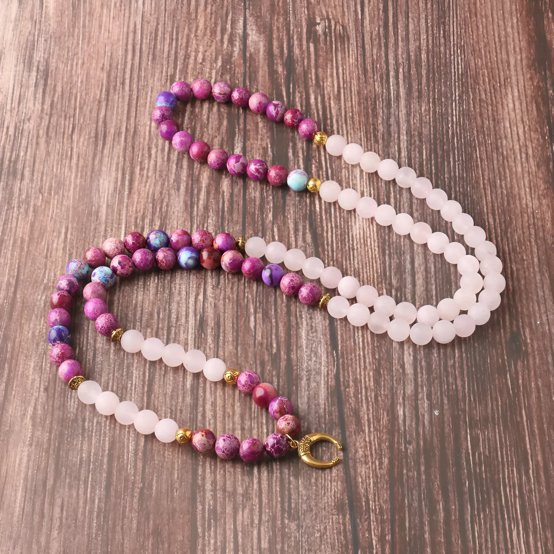 Round pink crystal emperor stone bead pendant on a women's personalised necklace.