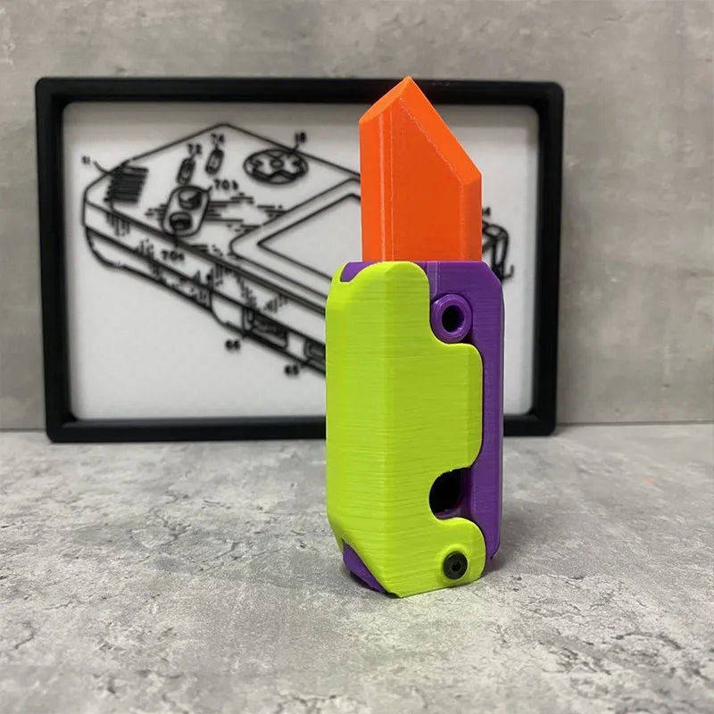 Small orange and green 3D printed plastic carrot knife fidget toy with blade extended.
