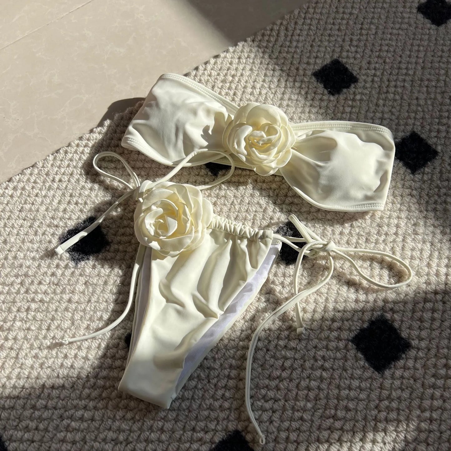 Women's adjustable drawstring tube top swimsuit with high-cut briefs in a solid colour.