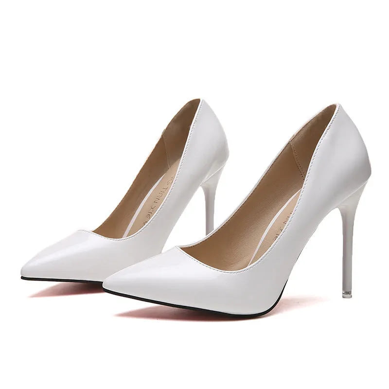 Women's pointed toe stiletto high heel pump in apricot colour with buckle detail.