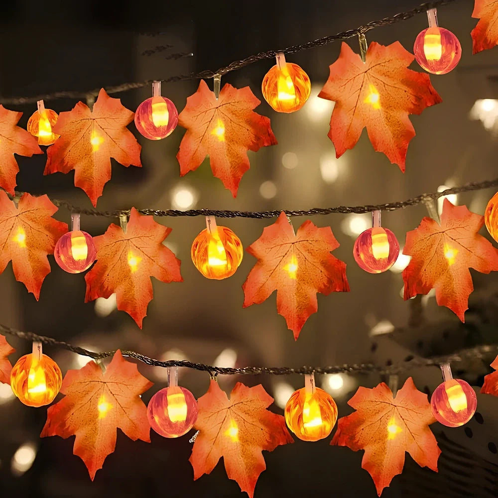 Halloween pumpkin light string with orange plastic pumpkins and warm white LED illumination
