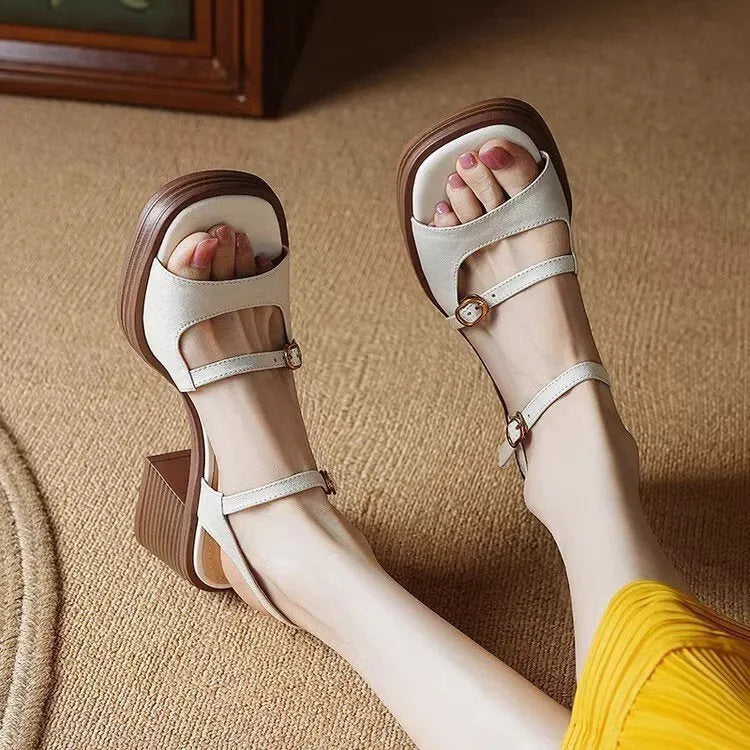 Beige women's open-toe square toe platform sandals with a retro design on a white background.