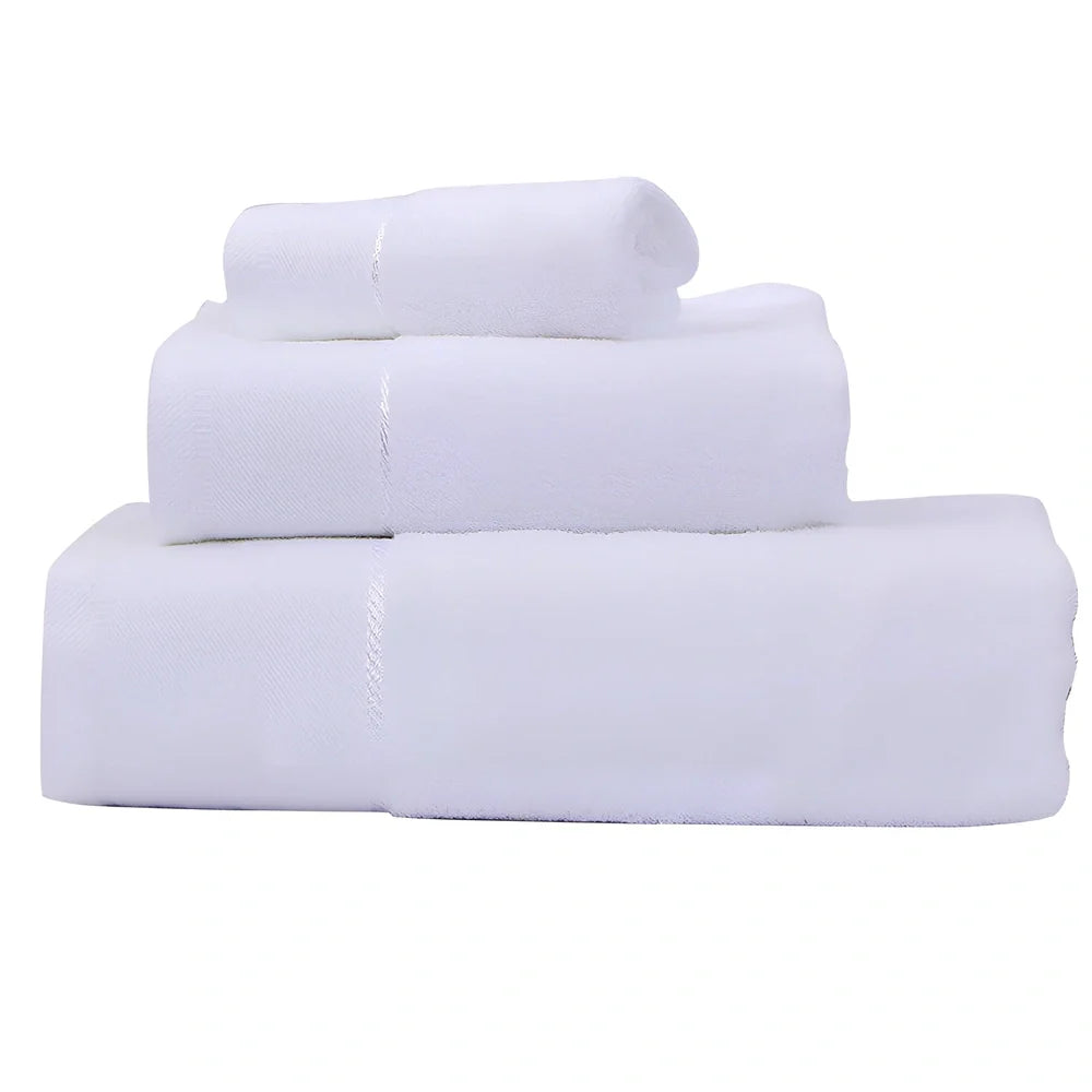 Three-piece cotton towel set showing 70x140cm bath towel, 35x75cm face towel, and 32x32cm square towel with combed yarn texture