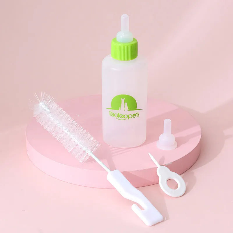 Four pet milk bottles in blue, green, pink and yellow colours with cleaning brush for small animal feeding