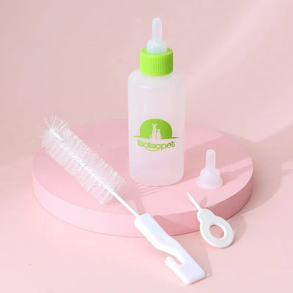 Four pet milk bottles in blue, green, pink and yellow colours with cleaning brush for small animal feeding