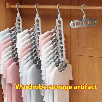 Green nine-hole folding hanger with trousers organised across nine hanging points, showing 45cm width