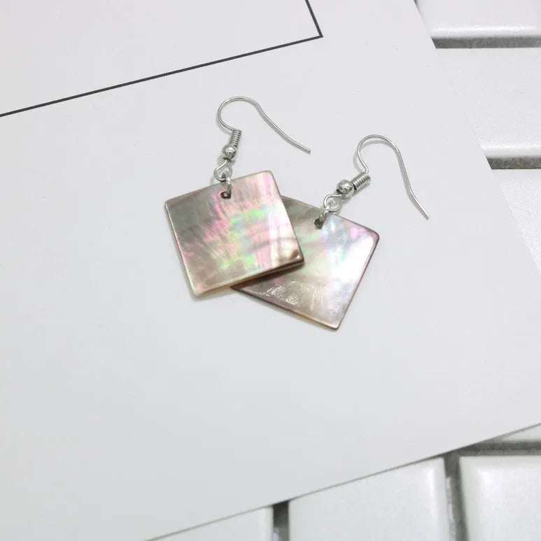 Natural shell earrings in geometric square and rectangular shapes with panther pattern detailing