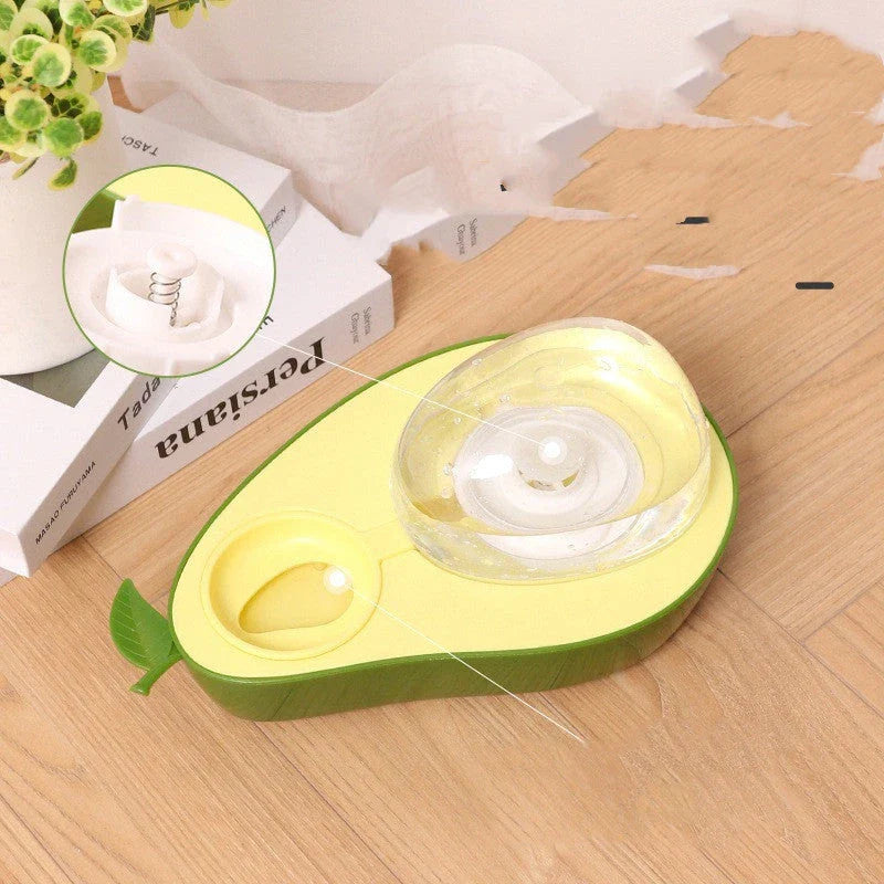 Avocado-shaped automatic pet feeder and water dispenser for dogs and cats, featuring slow-feed bowl, adjustable water flow, and durable construction