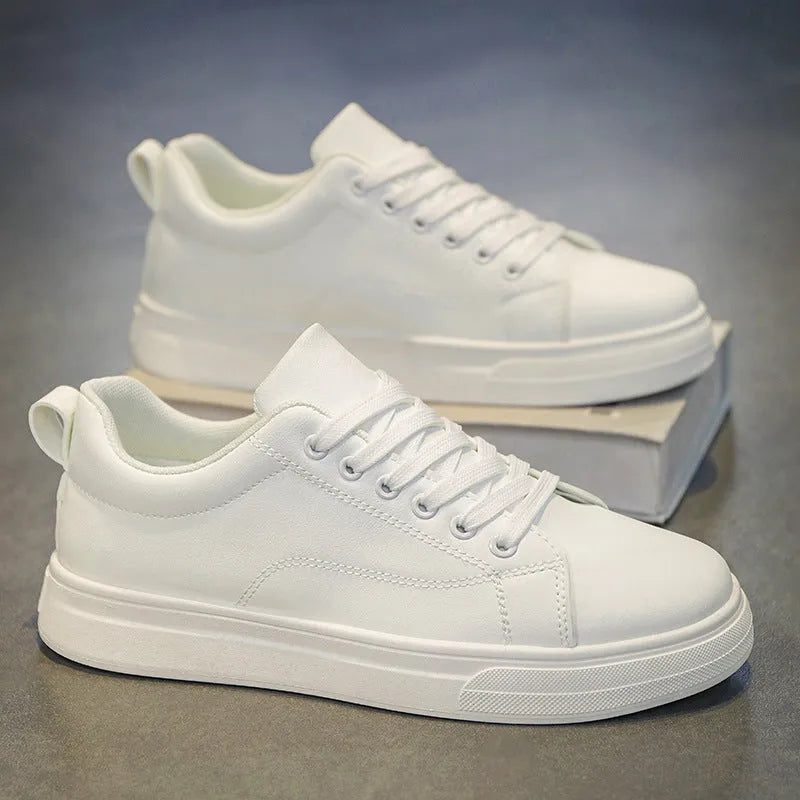 Men's low top casual sneakers in Korean style, shown in black, white, and two-tone colour options on a rubber sole.