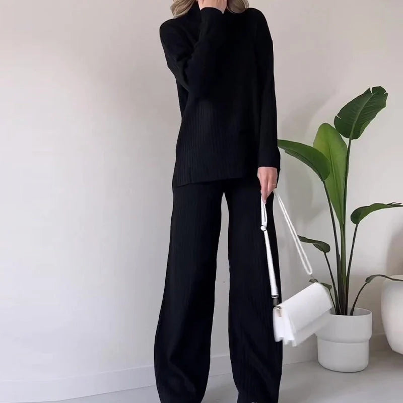 Women's turtleneck knitted suit set with loose split design and straight trousers in white, black, and green