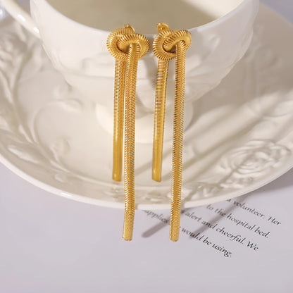 Gold electroplated titanium steel knotted tassel necklace and matching earrings set on a white background.
