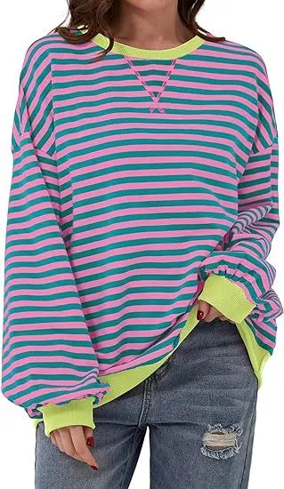 Striped sweatshirt in navy blue, pink, and orange with contrasting colors and ribbed cuffs