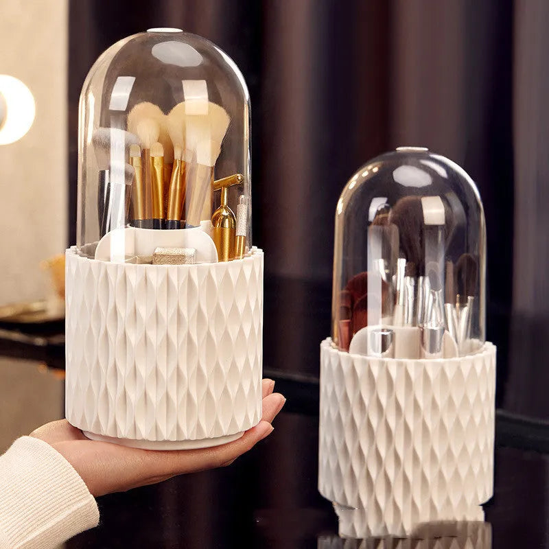 White rotating acrylic makeup brush holder with transparent dust cover on desktop
