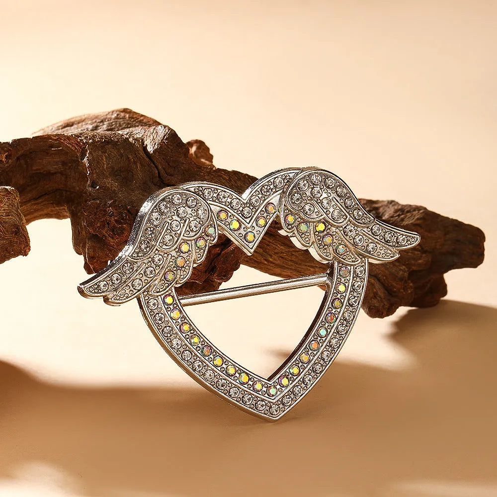 Bow-shaped waist-cinching accessory clip for high-end brooches, alloy with electroplating and diamond inlay, shown in gold, silver, or rose gold finishes.
