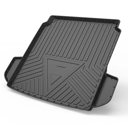 Black car boot liner with carbon fibre pattern texture, lying flat as a protective tailgate mat.