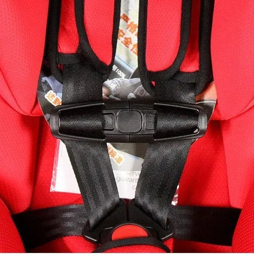 Black nylon seat belt buckle clip for adjusting child car seat harness straps.